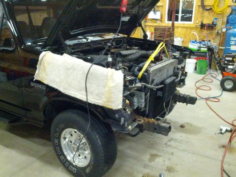 1995 Ford Bronco - This 1995 Ford Bronco is in a garage with its front end disassembled for repairs.