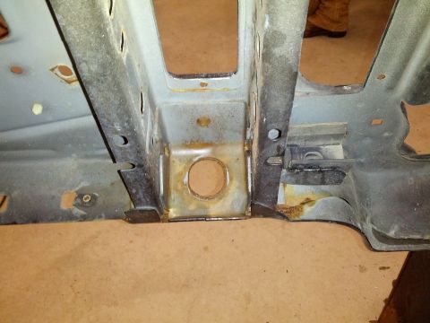 1995 Ford Bronco - A close-up view of the 1995 Ford Bronco's frame shows signs of rust and wear.