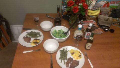 1995 Ford Bronco - A table is set for a meal, complete with plates of food, salad, drinks, and condiments.