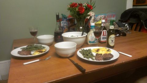 1995 Ford Bronco - A table is set for a meal with food, drinks, and flowers.
