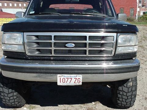 1993 Ford Bronco - Front view of a 1993 Ford Bronco, showing its grille and headlights.