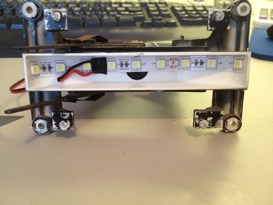 LED strip light assembly with DC12V markings