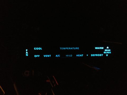1979 Ford Bronco - Illuminated climate controls display fan speed, temperature settings, and defrost options.
