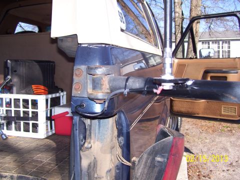 1990 Ford Bronco - Close-up view of a CB antenna mount installed on the interior door frame of a vehicle.