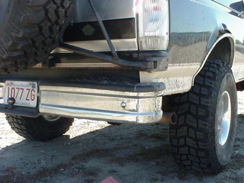 1993 Ford Bronco - Rear view of a 1993 Ford Bronco, showing the bumper, spare tire, and Massachusetts license plate.