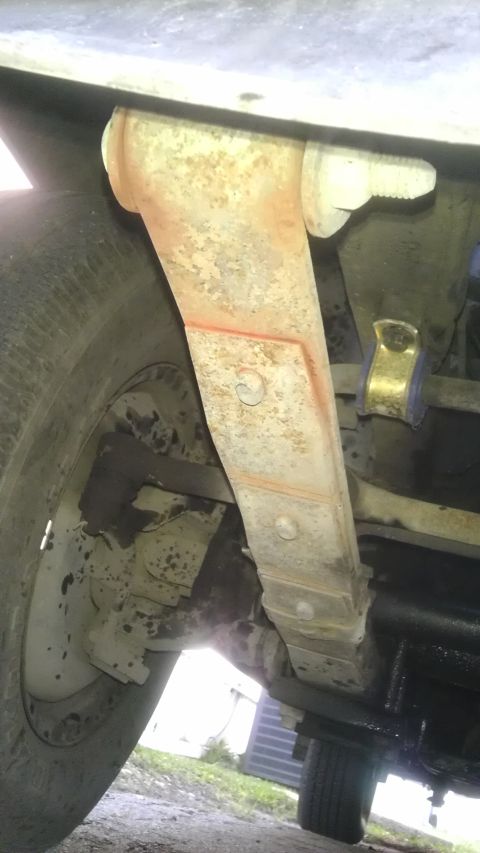1982 Jeep Wagoneer - Leaf spring and suspension parts are visible in this close-up view.