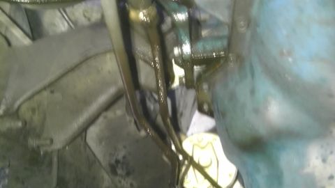 1982 Jeep Wagoneer - This image shows a close-up view of engine components with visible oil leaks.