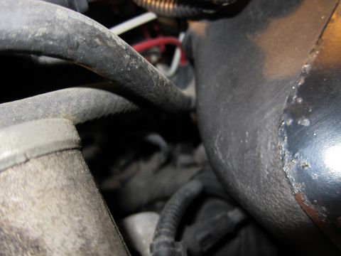1991 Ford LTD Crown Victoria - Engine bay hoses and wiring detail, with focus on rubber tubing and electrical connections.