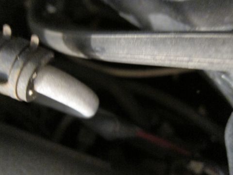 1991 Ford LTD Crown Victoria - Detail of a metal automotive component, possibly from an engine bay or undercarriage.