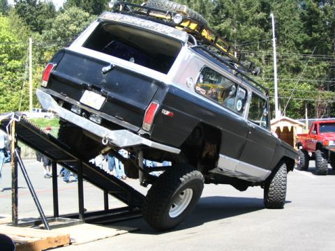 1982 Jeep Wagoneer - This modified 1982 Jeep Wagoneer is positioned on a ramp, its lifted suspension and off-road tires.