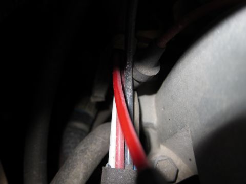 1991 Ford LTD Crown Victoria - Wiring harness with multiple colored wires visible in a dark engine compartment.
