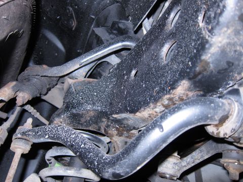 1991 Ford LTD Crown Victoria - Undercarriage view shows suspension parts, including a sway bar and coil springs.