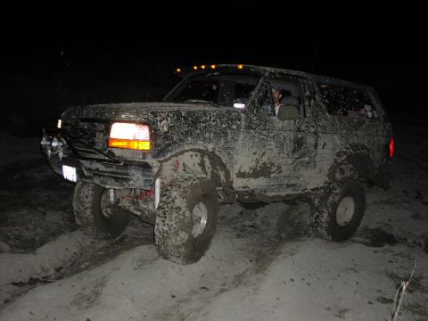1995 Ford Bronco - This 1995 Ford Bronco is covered in mud after an off-road excursion at night.