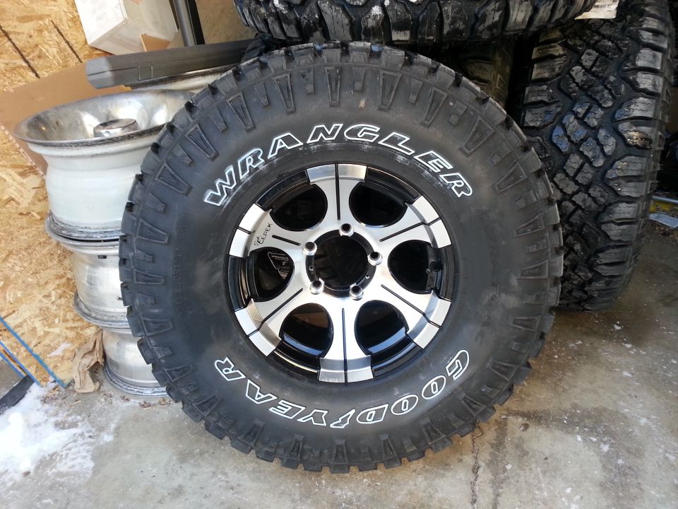Goodyear Wrangler tire on a silver and black alloy wheel