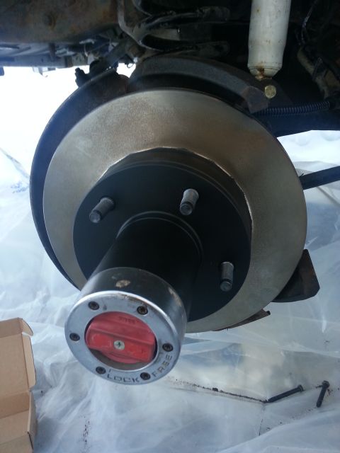 1994 Ford Bronco - The photo shows a close-up of a vehicle's brake rotor and hub assembly, with visible text indicating 'LOCK' and 'FREE' settings.