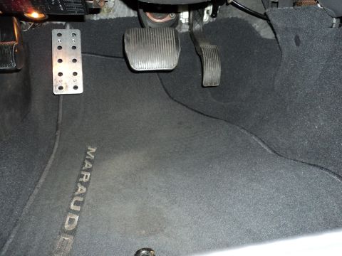 2004 Mercury Grand Marquis - Close-up of car interior floor mats and pedals, showing the 'Marauder' name.