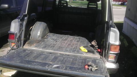 1982 Jeep Wagoneer - The cargo area of a 1982 Jeep Wagoneer is visible with the tailgate down.