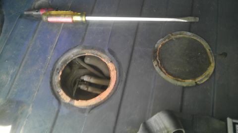 1982 Jeep Wagoneer - Accessing the fuel pump requires removing this cover and disconnecting the fuel lines.