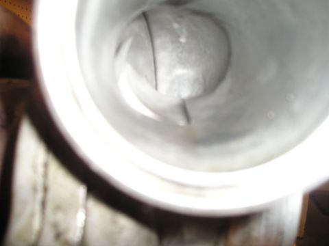 1997 Ford F-250 - Close-up view inside a metal pipe, showing its internal structure.