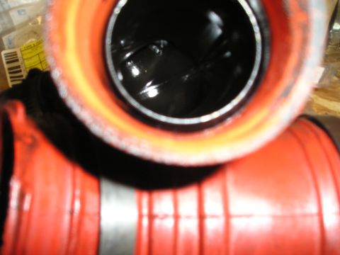 1997 Ford F-250 - Close-up view of a turbocharger intake pipe, with a visible Supermotors.net logo at the bottom right.