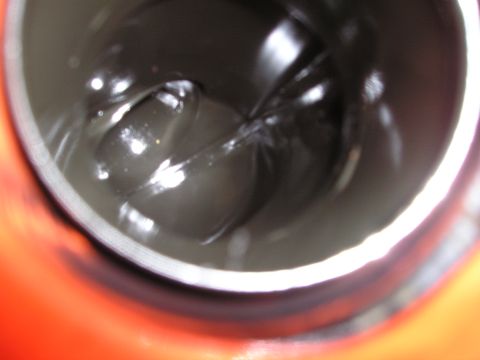 1997 Ford F-250 - Grease inside a container, likely for vehicle maintenance.