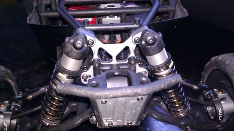 1996 Ford Bronco - Close-up view of the front suspension system on an RC car.