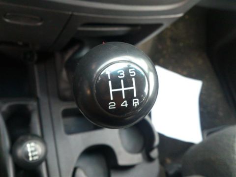 2004 Dodge 1500 - Close-up of a manual transmission shifter, showing the gear pattern for 1, 2, 3, 4, 5, and reverse.