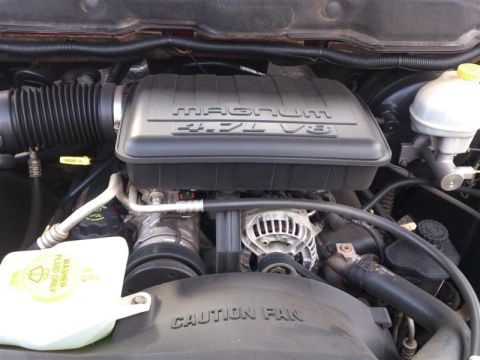 2004 Dodge 1500 - Close-up of the engine bay, showing the Magnum 4.7L V8 engine cover and associated components.