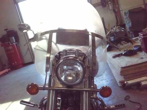 1995 Ford F-150 - Front view of a motorcycle with a large clear windshield and chrome accents.