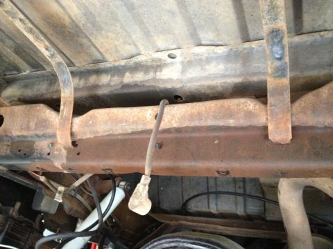 1978 Ford Bronco - Undercarriage components including frame, fuel line, and shock absorber are visible in this photo.