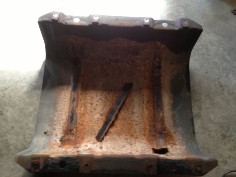 1978 Ford Bronco - This heavily rusted metal component shows significant wear and tear.