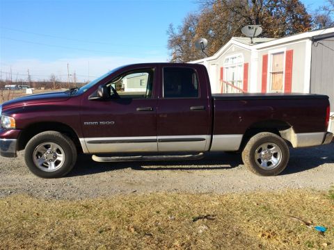 2004 Dodge 1500 - Side view of a 2004 Dodge Ram 1500 pickup truck with a crew cab.
