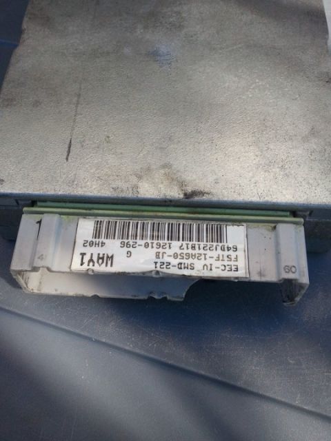 1994 Ford Bronco - A close-up view of a Ford engine control module, identified by its part number and label.