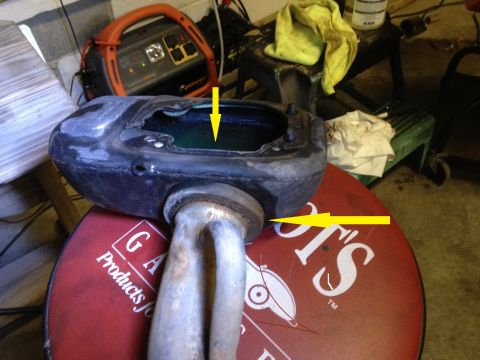 1978 Ford Bronco - An exhaust manifold part is shown with yellow arrows indicating connection points.