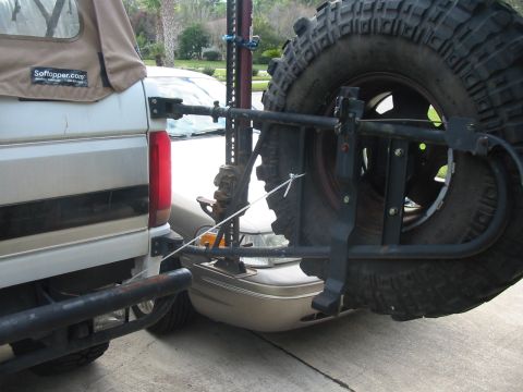 1992 Ford Bronco - Added a cable stay for the tire carrier. Helps if I forget to re-latch the carrier before I drive away.