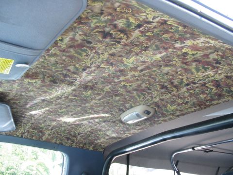 1992 Ford Bronco - old headliner was beat up and hanging off the roof. bought this material at wally world and can of 3M adhesive. took me about an 2 hrs to d…