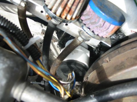 1992 Ford Bronco - needed to get these wires through the firewall, got a hole saw and opened up the clutch plate blank, the got a piece of pvc and was able to…