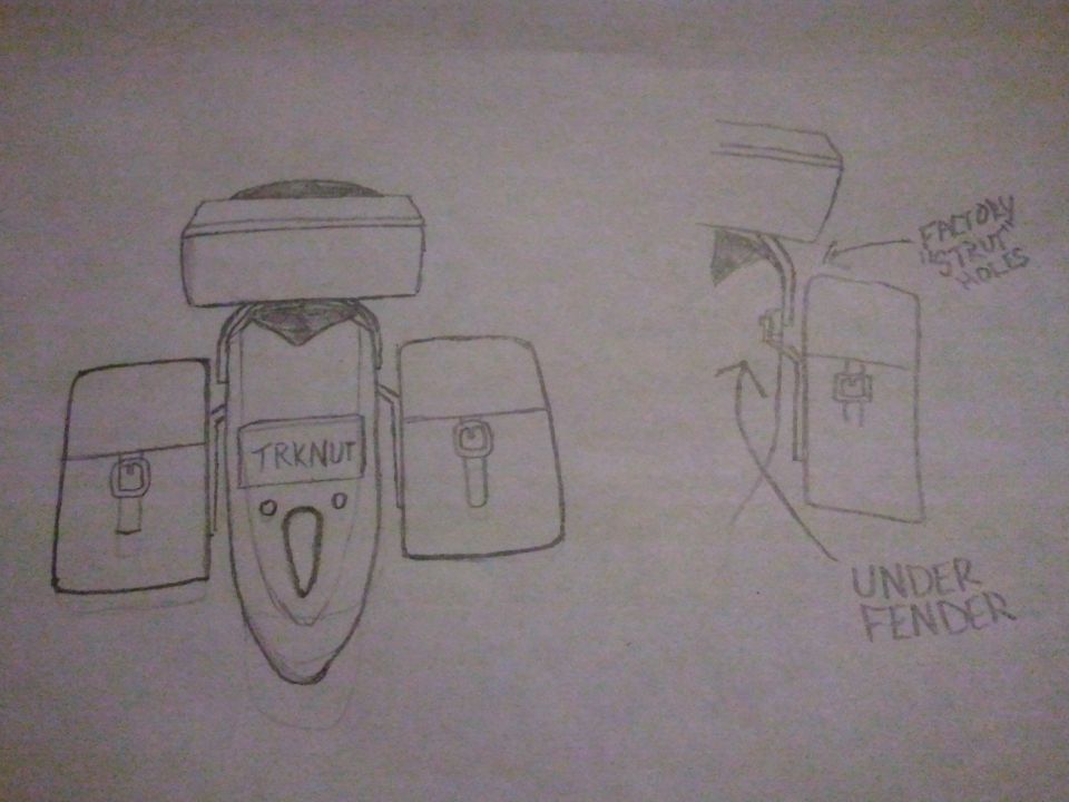 Hand-drawn pencil sketch of mounting brackets labeled TRKNUT and factory strut holes under fender
