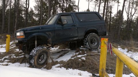 1995 Ford Bronco - This 1995 Ford Bronco is navigating a snowy, wooded area.