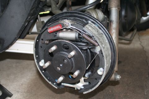 1976 Ford Ranchero - Close-up view of a vehicle's drum brake assembly, showing internal components.