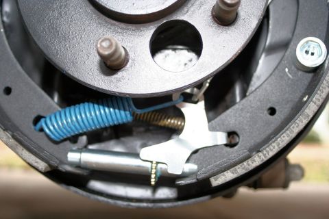 1976 Ford Ranchero - This photo shows the internal components of a vehicle's drum brake system, including brake shoes and springs.