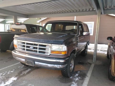 1992 Ford Bronco - This 1992 Ford Bronco is parked under a carport, with snow on the ground.