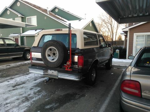1992 Ford Bronco - Rear view of a 1992 Ford Bronco with a Hi-Lift jack mounted on the spare tire carrier.