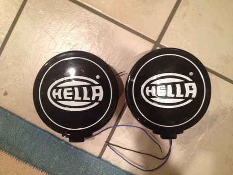 1996 Ford Bronco - Pair of Hella fog lights shown on a tiled floor.