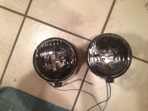 1996 Ford Bronco - Pair of aftermarket fog lights shown on a tiled surface.