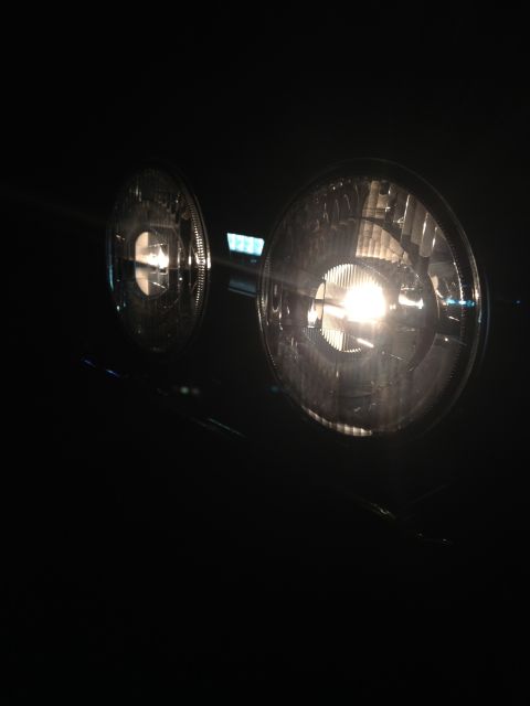 1996 Ford Bronco - Close-up of vehicle headlights at night, with a watermark at the bottom.