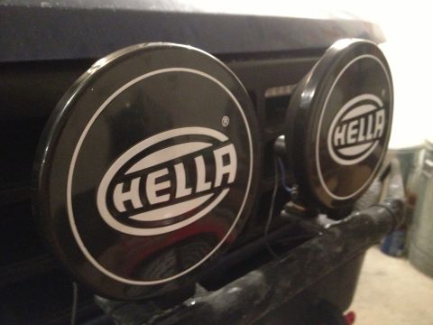 1996 Ford Bronco - Close-up of Hella fog lights attached to the front of a vehicle.