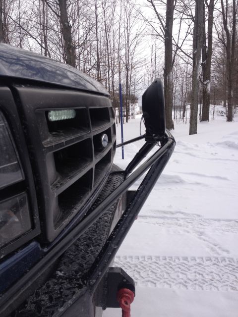 1996 Ford Bronco - Front view of a 1992 Ford Bronco with a custom bumper and lights in a snowy setting.