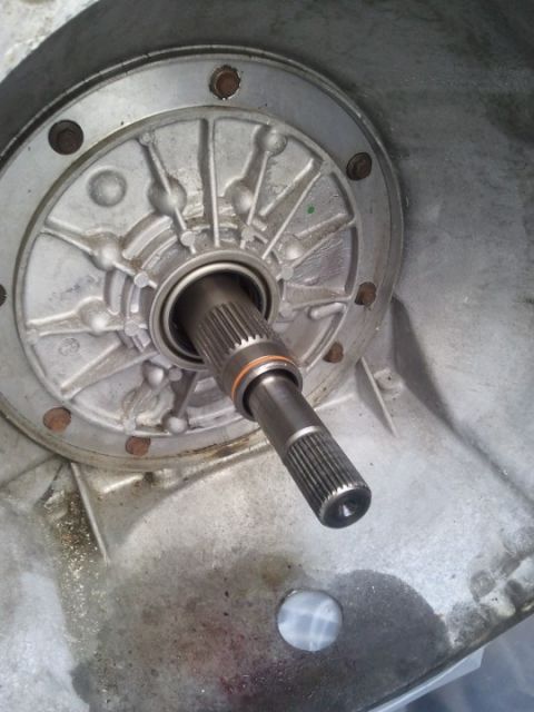 1994 Ford Bronco - Close-up view of a transmission pump and its input shaft, indicating internal mechanical components.