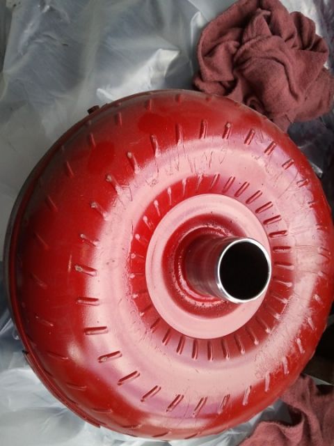 1994 Ford Bronco - A red torque converter is shown, likely a replacement part for a vehicle's transmission.
